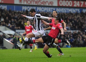 Gary Neville escapes punishment after fouling Graeme Dorrans in the penalty area.